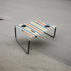 Neso Beach Table - Lightweight, Portable and Foldable Table for Beach, Camping and Outdoor Adventures - Stable Surface - with Cup Holder for Drinks and Phone Pockets - Vintage Stripes
