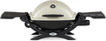 Weber Q1200 Liquid Propane Portable Gas Grill, Titanium – 1‑Burner Travel and Camping Grill with Cast‑Iron Grates & Electronic Ignition (8,500 BTU Burner)