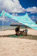 Neso Grande Portable Beach Tent Sun Shelter - Lightweight Beach Shade Canopy - Easy Setup for Family Outings - Patented Reinforced Corners - UPF 50+ Sun Protection - 7ft Tall, 9 x 9ft