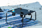Neso Beach Table - Lightweight, Portable and Foldable Table for Beach, Camping and Outdoor Adventures - Stable Surface - with Cup Holder for Drinks and Phone Pockets - Black