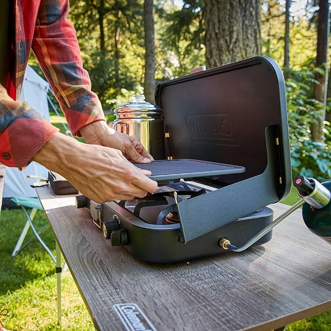 Coleman 1900 Collection 3-in-1 Propane Camping Stove, Cast Iron Grill & Griddle Accessories Included, 24,000 BTUs Across 2 Adjustable Burners with Wind Guards & Matchless Lighting