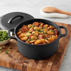 Amazon Basics Pre-Seasoned Cast Iron Mini Dutch Oven Pot with Lid and Dual Handles, Oven Safe, 2-Quart, Round, Black
